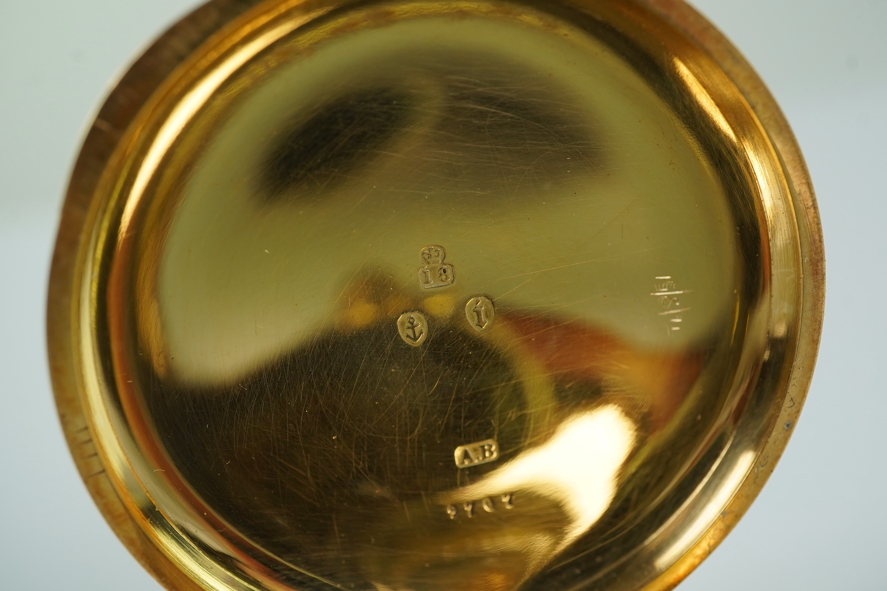 A late Victorian engine turned 18ct gold open faced keyless pocket watch by The American Waltham Watch Company